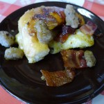 Frenched cinnamon roll topped with bacon & sausage
